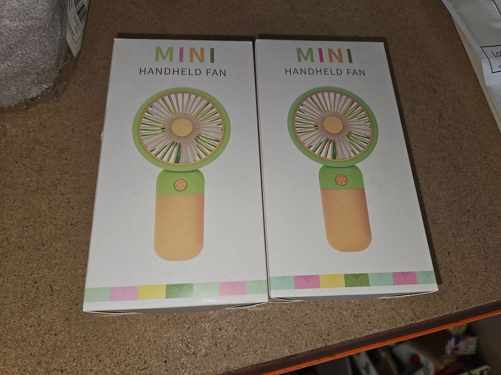 Lot 275 – A Pair of Mini Handheld Portable Cooling Fans in Original Retail Packaging