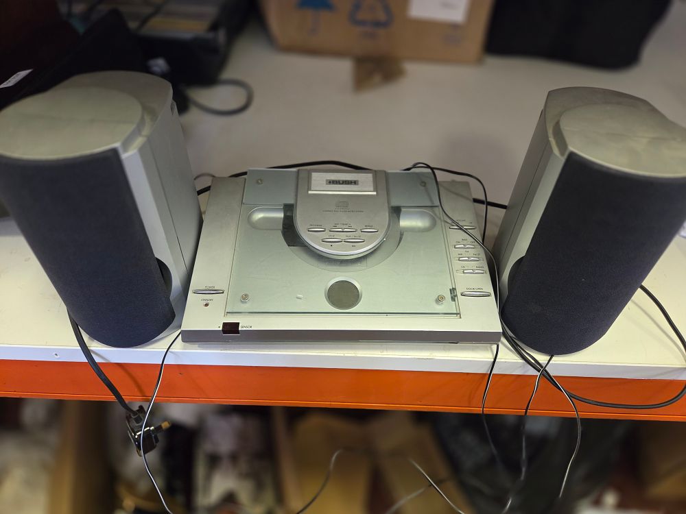 Lot 319 – A Bush Compact Disc Player Micro System with Speakers powers on