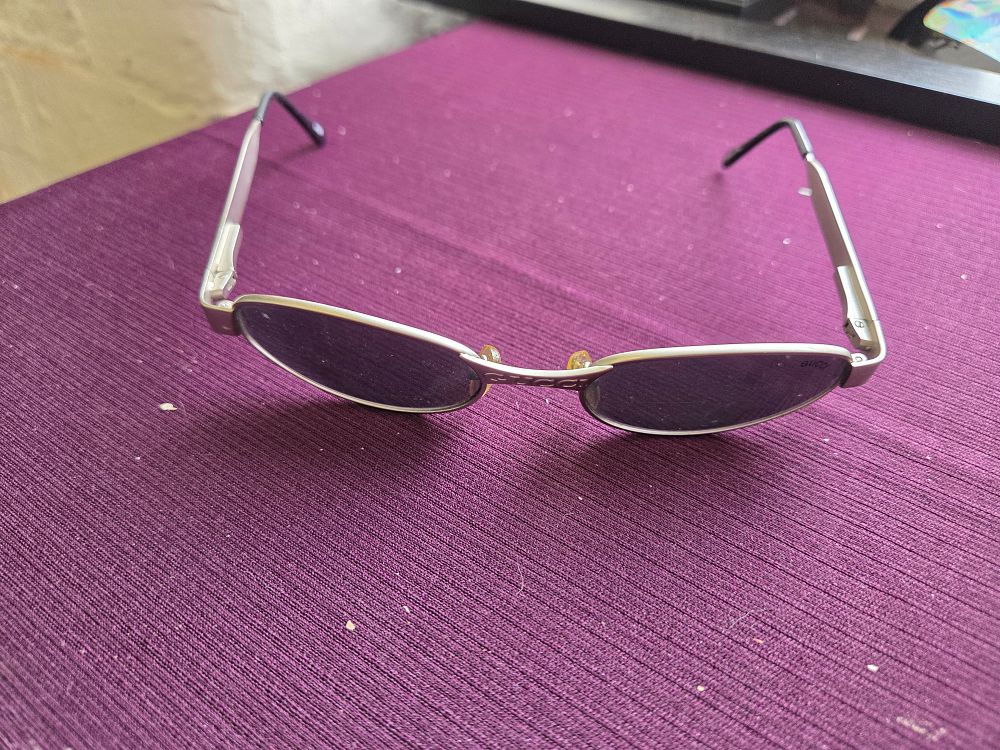 Lot 641 – A Pair of Gucci Vintage Oval Matt Silver Toned Metal Sunglasses