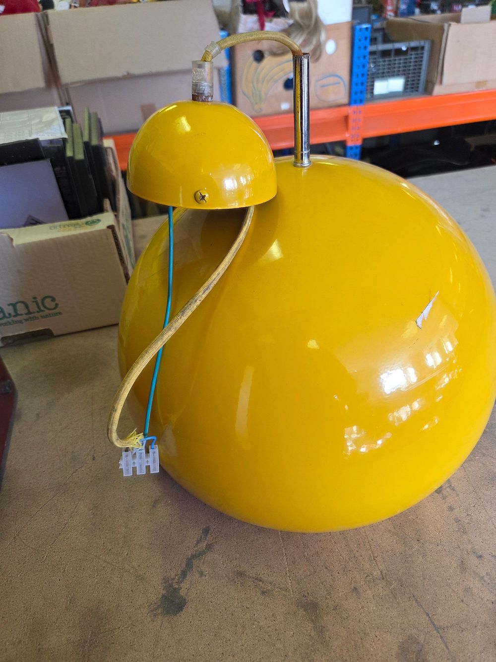 Lot 184 – A Mid-Century Modern Yellow Enamel Spherical Pendant Light