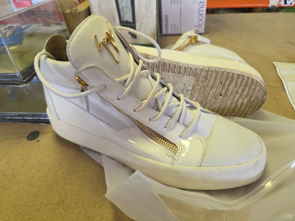 Lot 253 – A Pair of Giuseppe Zanotti Kriss White Leather High-Top Sneakers