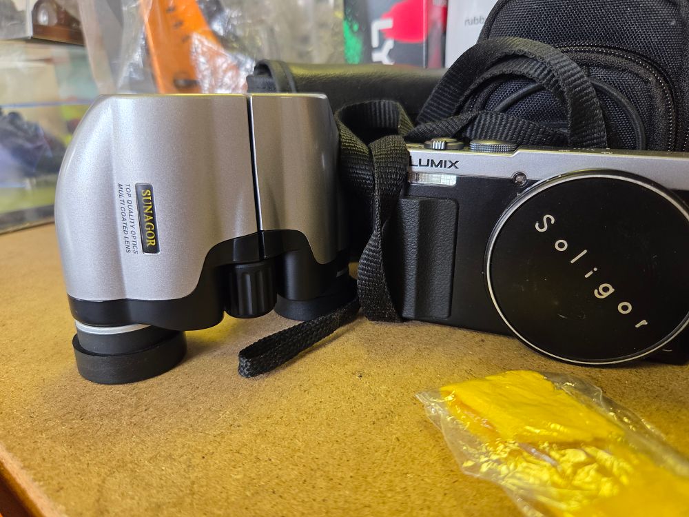 Lot 267 – Two Items Comprising a Panasonic Lumix DMC-LF1 Digital Camera and Sunagor Compact Binoculars