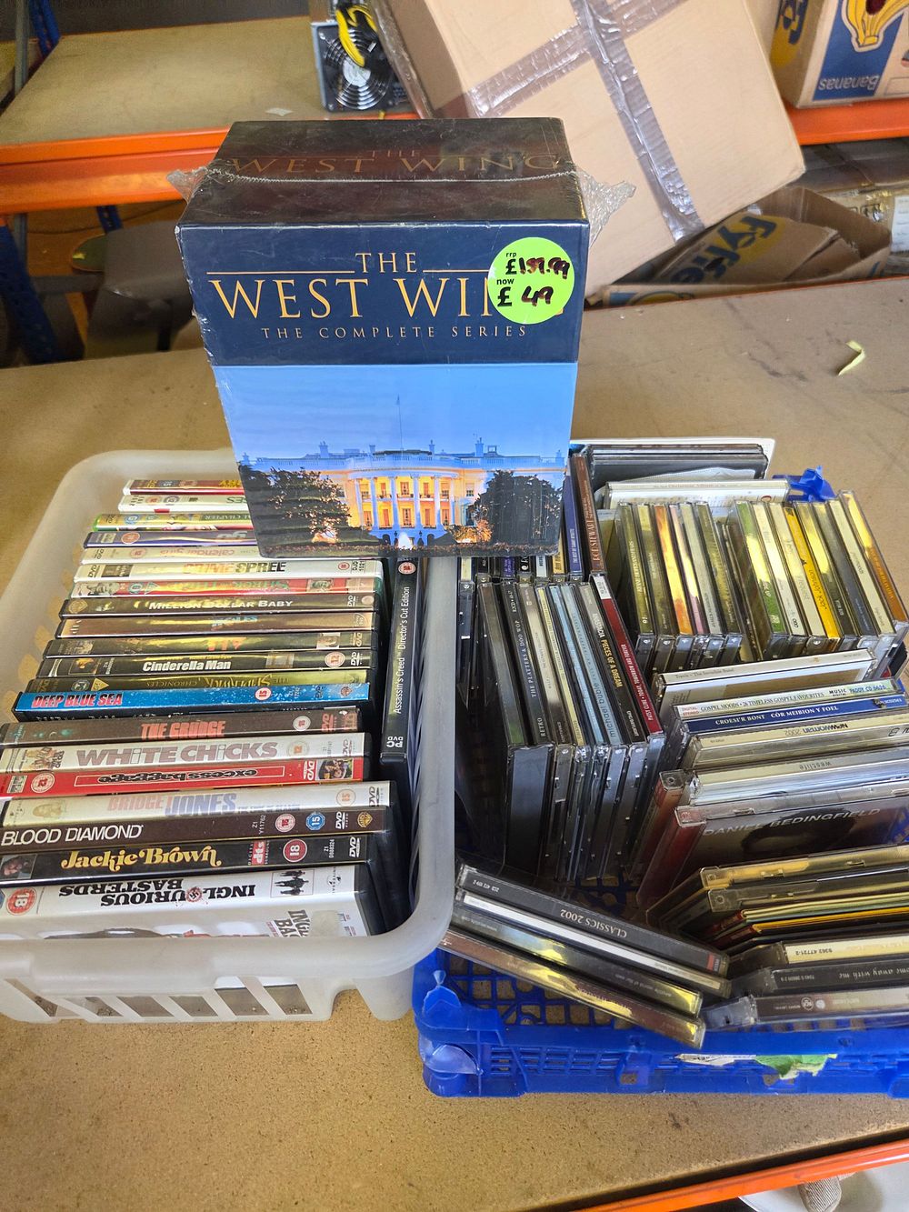 Lot 288 – Two Boxes of DVD Box Set and Assorted Music CDs including The West Wing The Complete Series