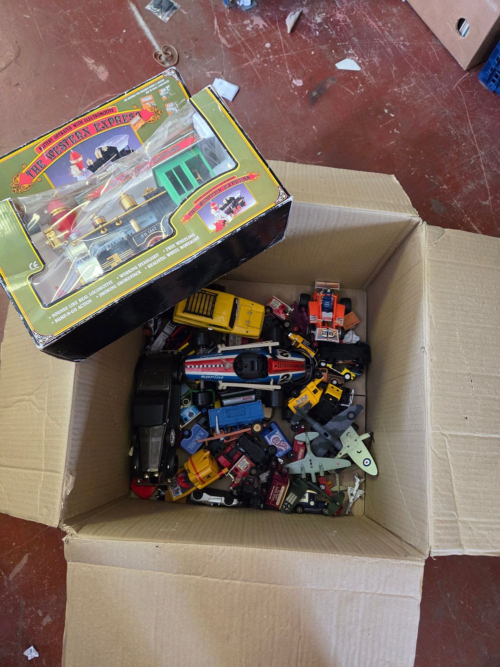 Lot 377 – A Collection of Vintage Die-Cast and Plastic Toy Vehicles to include a Boxed Western Express Train Set and Lledo Days Gone Delivery Vans