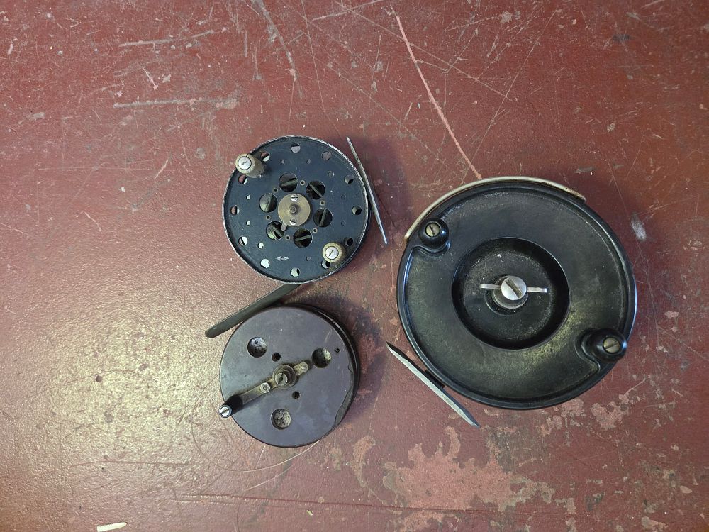 Lot 381 – A Trio of Vintage Fishing Reels including a Centrepin Trotting Reel, a Fly Reel and a Large Sea Reel