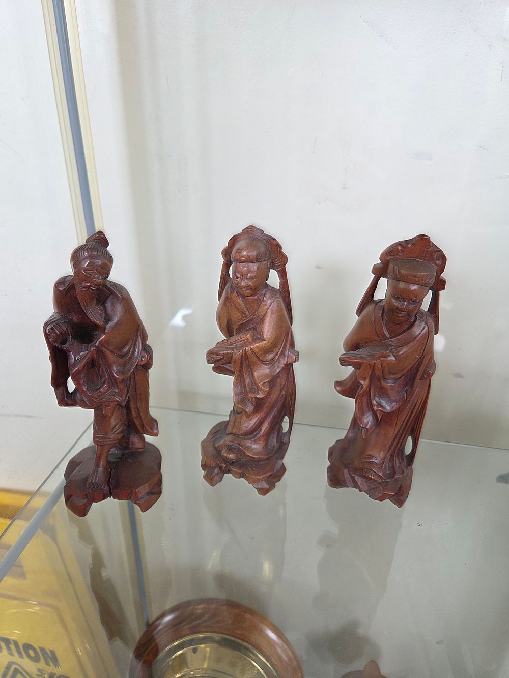 Lot 602 – Three Chinese Carved Hardwood Figures of Scholars and an Immortal