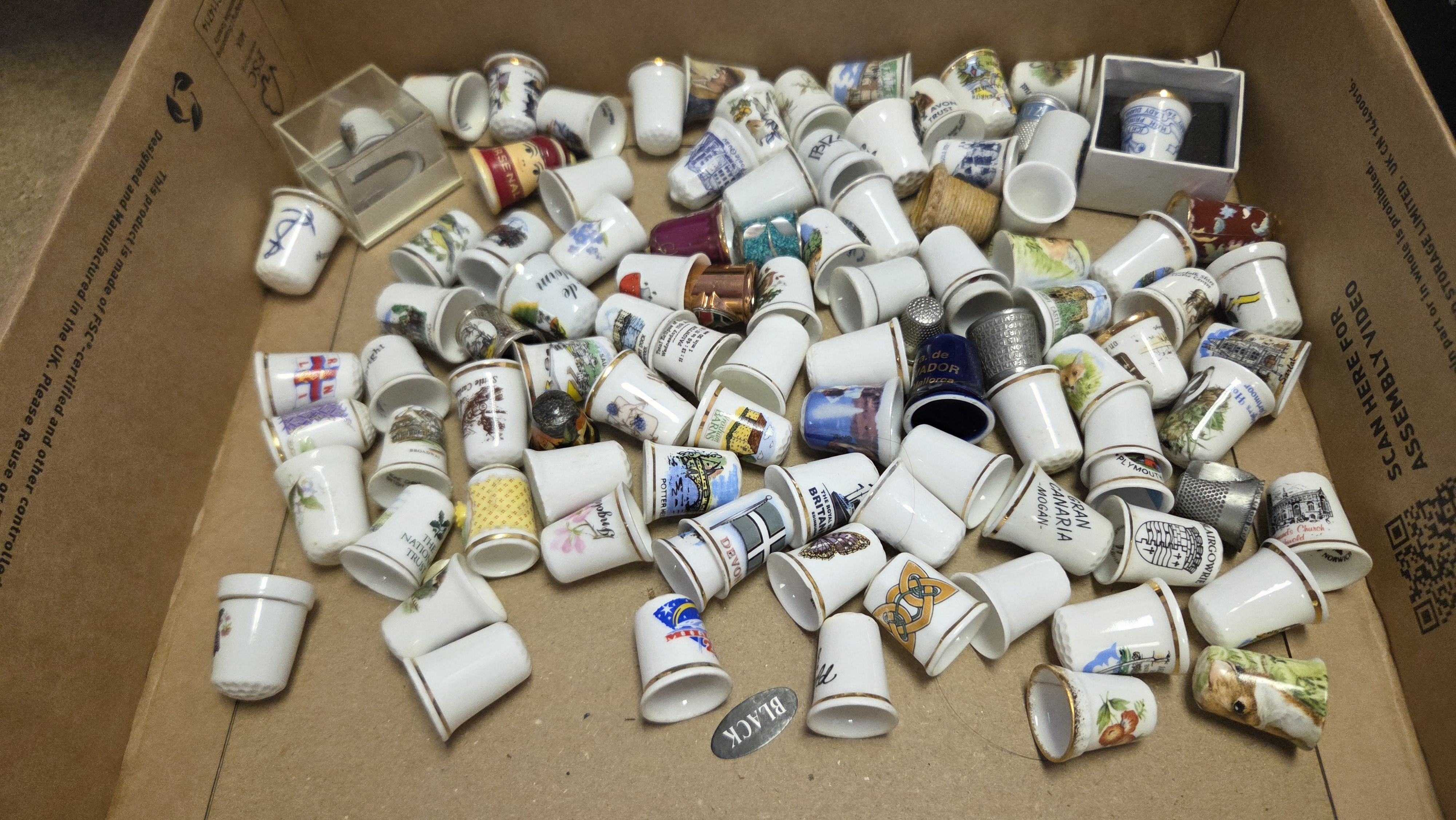 A Collection of Porcelain and Metal Souvenir and Decorative Thimbles