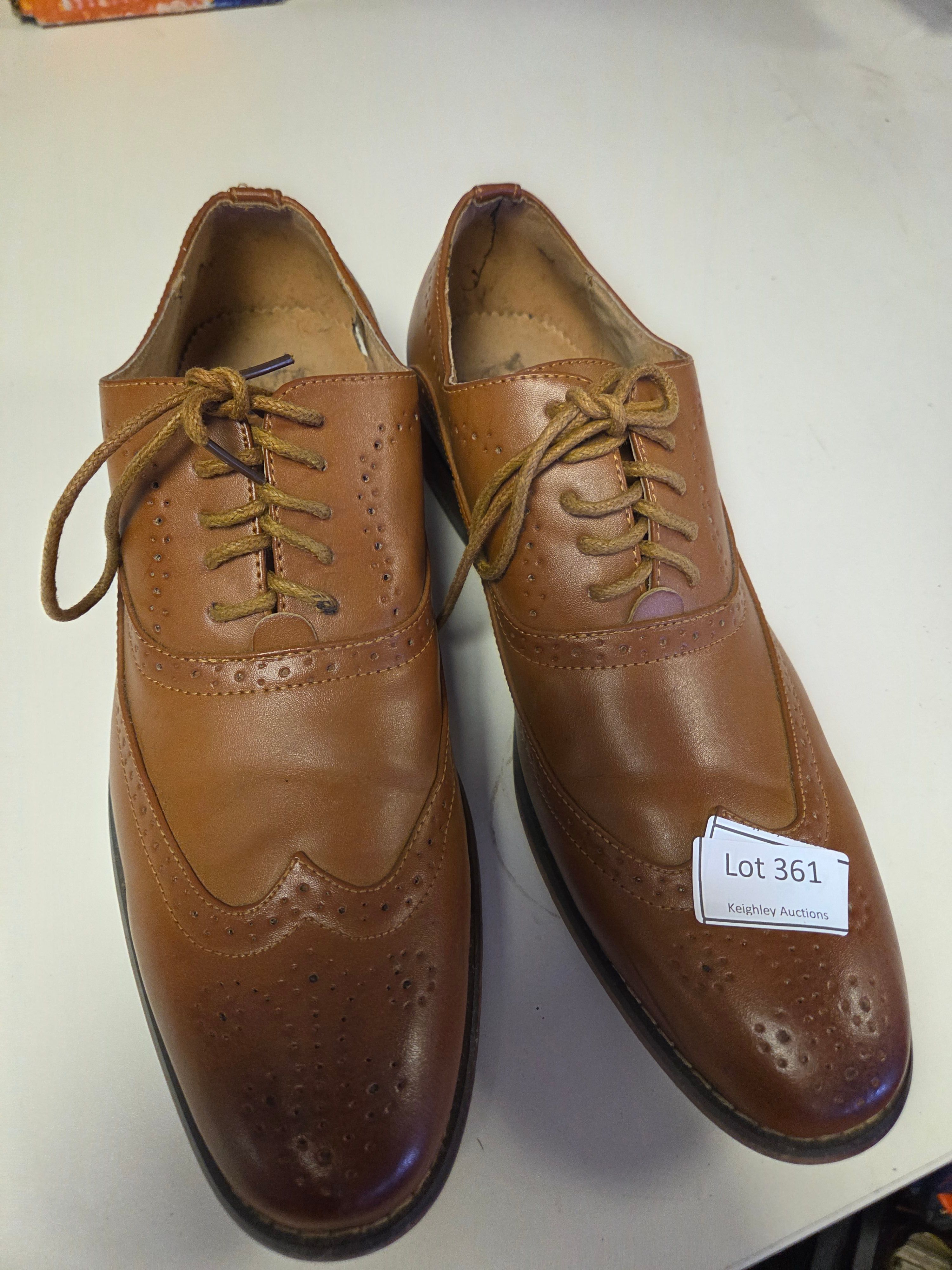 A Pair of Men's Tan Leather Wingtip Brogue Derby Shoes