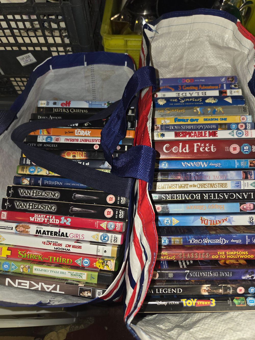 Lot 174 – Two Bags of Miscellaneous DVDs Including Disney Pixar and The Simpsons