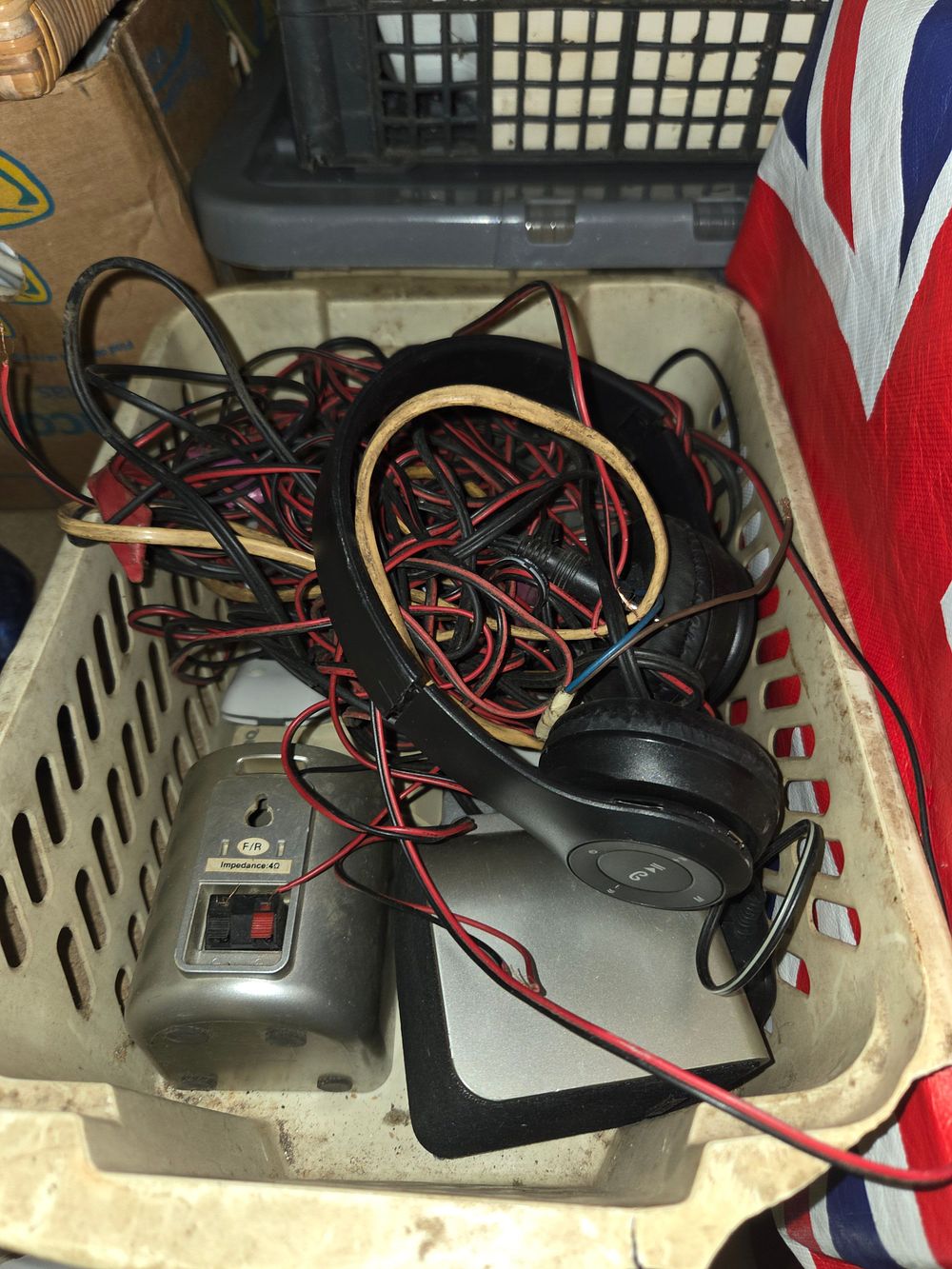 Lot 175 – One Basket of Miscellaneous Electronics Including Wireless Headphones and Satellite Speakers