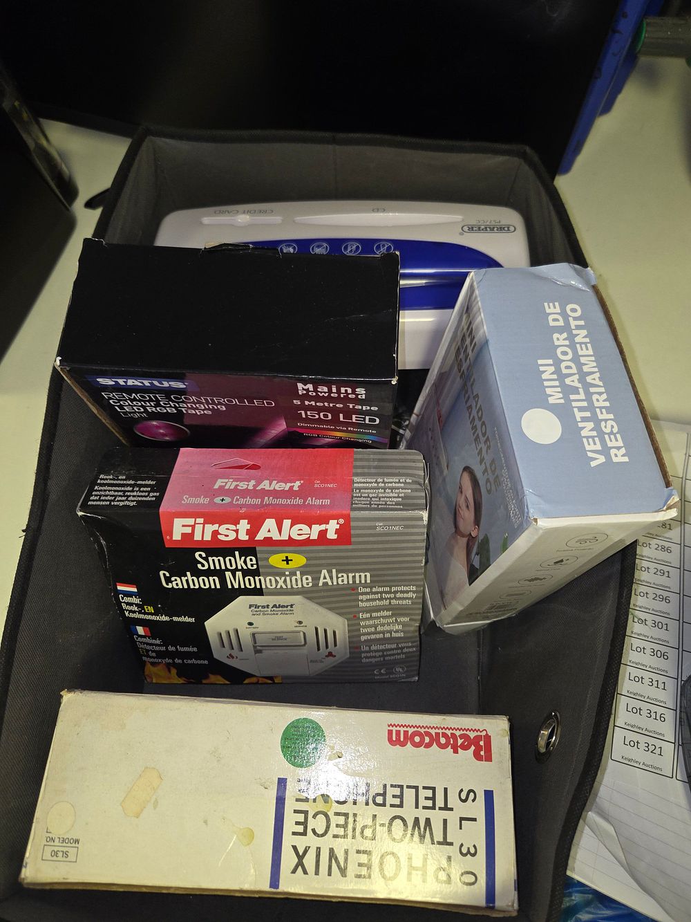 Lot 267 – One Box of Miscellaneous Household Electronics Including First Alert Betacom