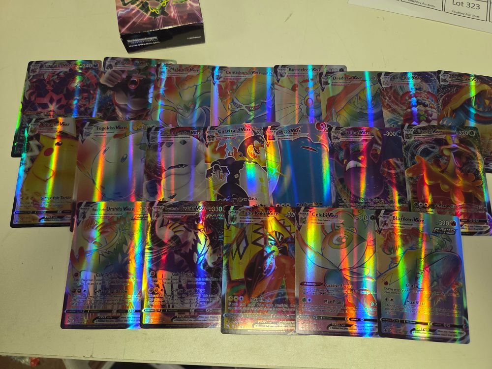 Lot 276 – A Collection of Twenty Trading Cards Including Charizard and Pikachu