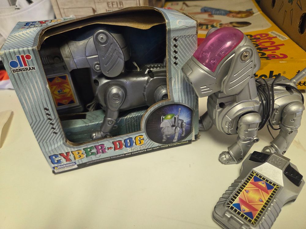 Lot 285 – Two Vintage Dongran No. 808 Cyber-Dog Wired Remote Control Robot Dogs.