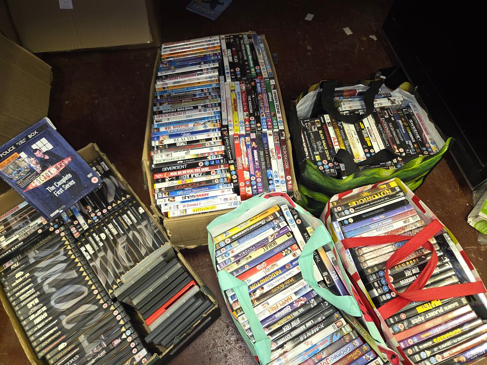 Lot 319 – Two Boxes and Three Bags of DVD and Blu-ray Films Including James Bond and Disney