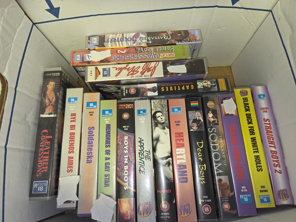 Lot 344 – Box of 16 Adult Gay Erotica VHS Tapes Including Jeff Stryker and Load Inc