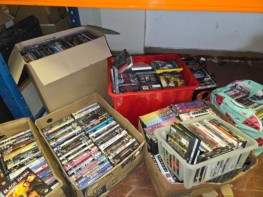 Lot 366 – Seven Boxes and Bags of DVD and Blu-ray Media Including Friends James Bond and Spider-Man
