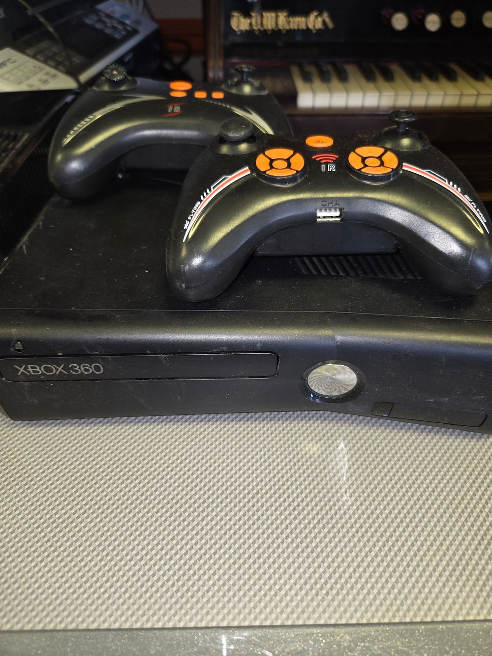 Lot 383 – Microsoft Xbox 360 S Game Console and 2 Syma Controllers untested