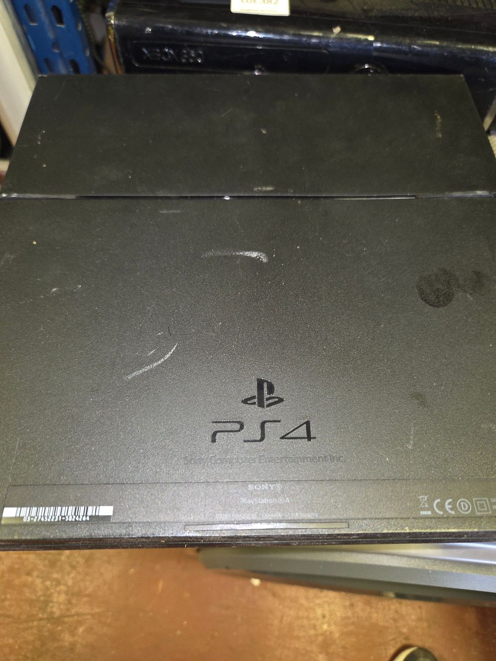 Lot 384 – Sony PlayStation 4 and Controllers powers on