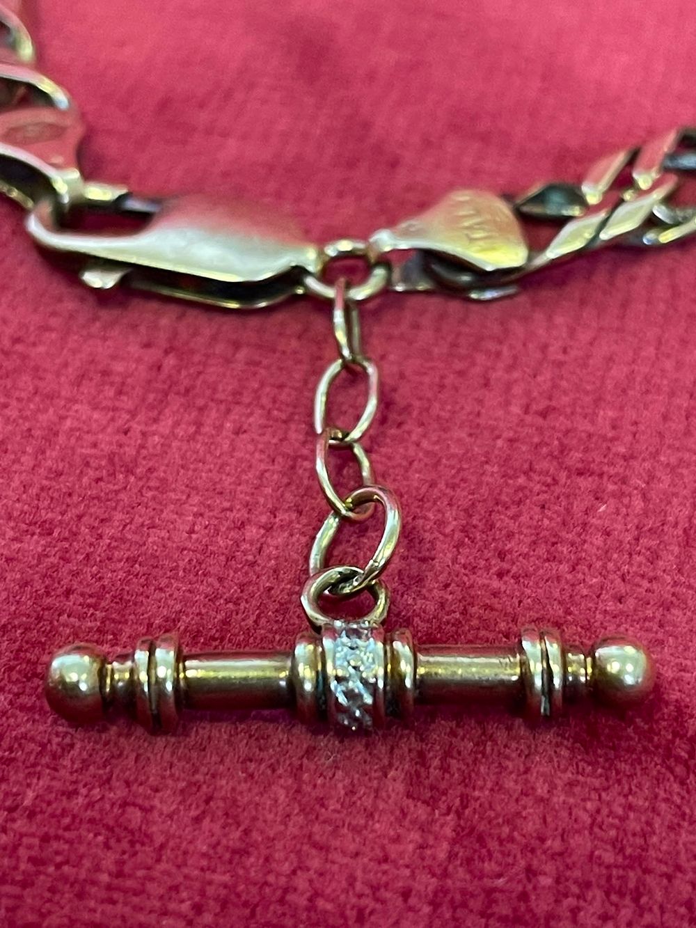 Lot 630 – An Italian 9ct Gold Curb Link Bracelet with Gem Set T-Bar Toggle 14.66g