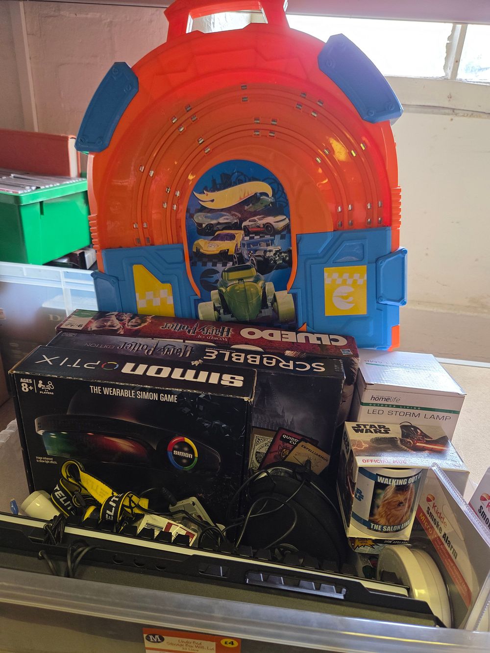 Lot 201 – One Box of Miscellaneous Toys and Household Electronics Including Hot Wheels and Harry Potter Games