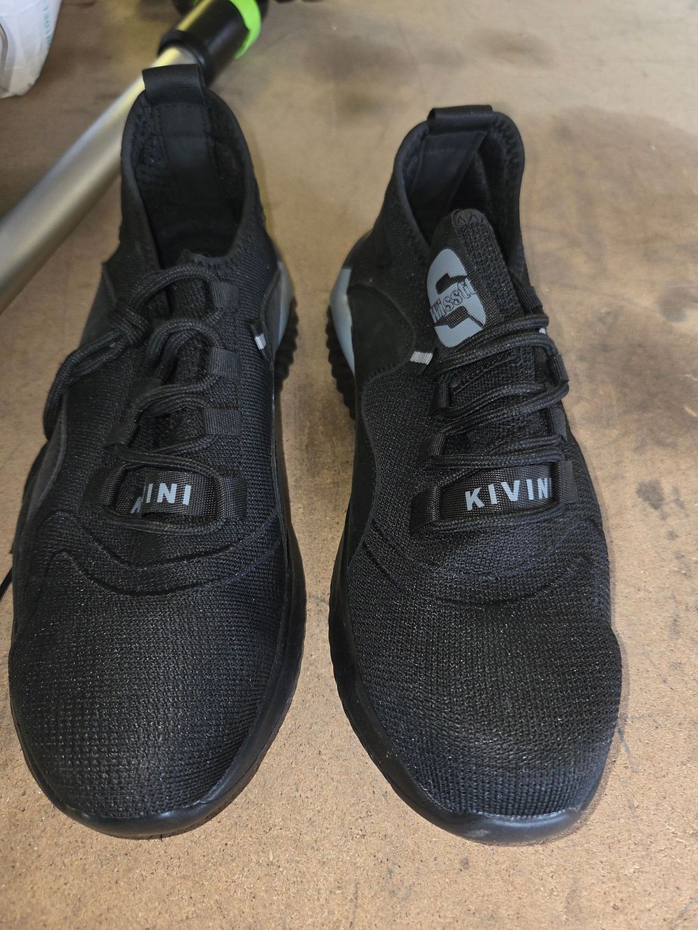 Lot 234 – A Pair of Kivin Black Knitted Slip-on Trainers size 46
