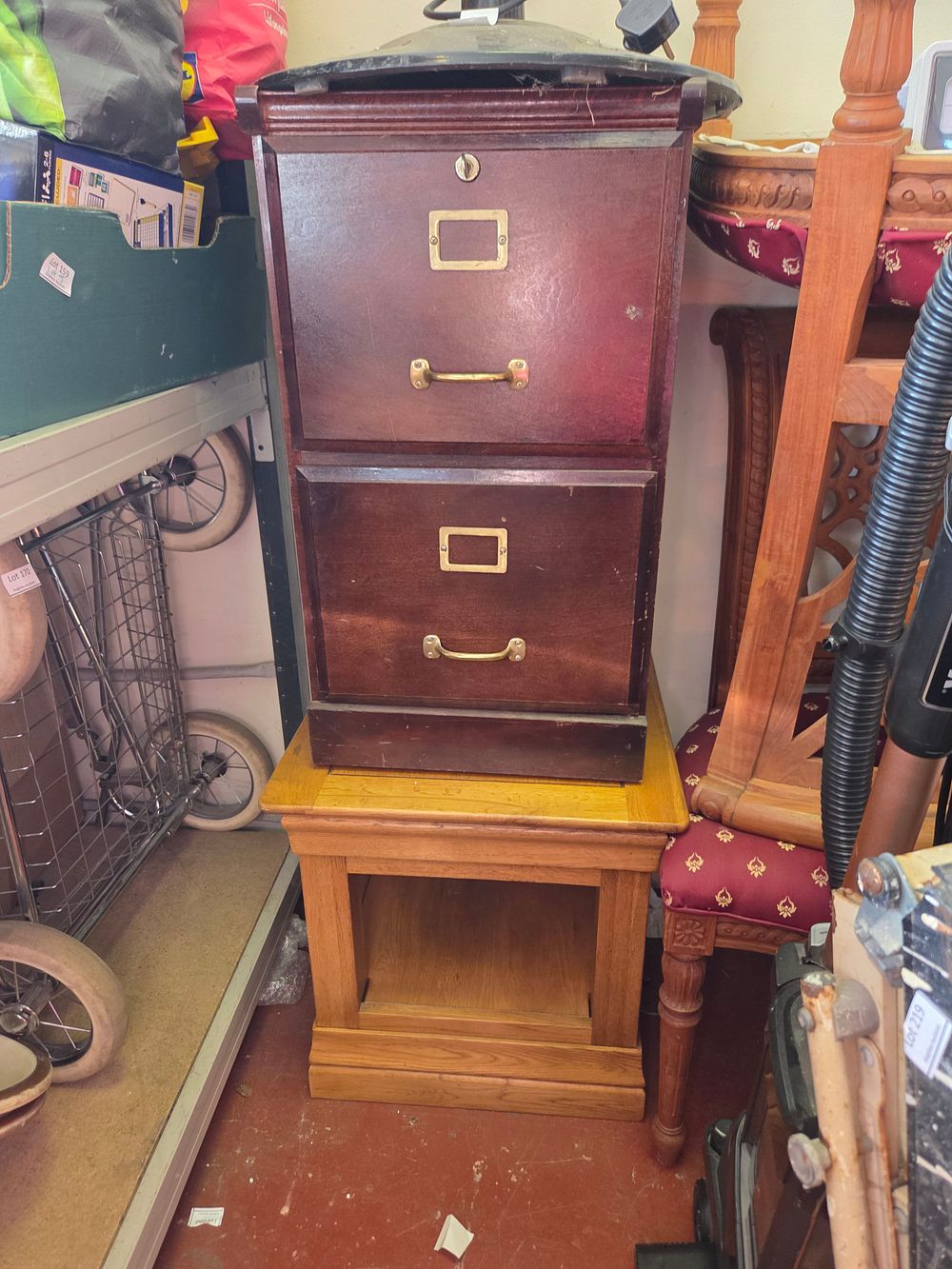 Lot 220 – A mahogany-finished two-drawer filing cabinet and an oak-effect open pedestal table