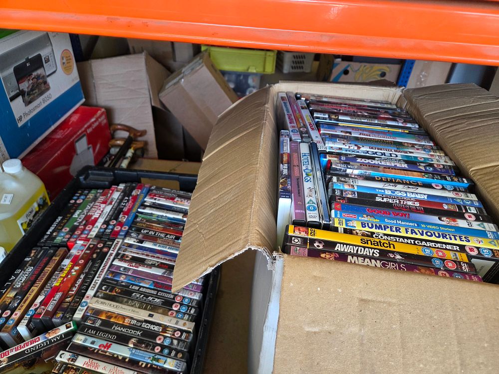 Lot 290 – Two Boxes of Retail DVDs Including Mean Girls Snatch and The Boss Baby