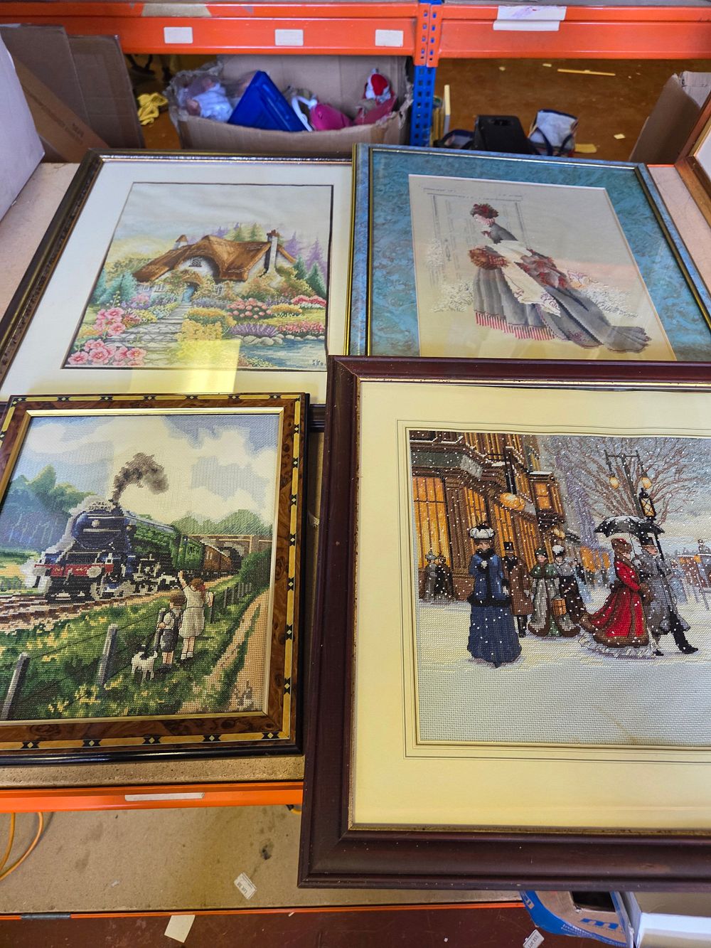 Lot 292 – Four Framed Cross-Stitch and Needlepoint Pictures Including Steam Locomotive and Thatched Cottage Scenes
