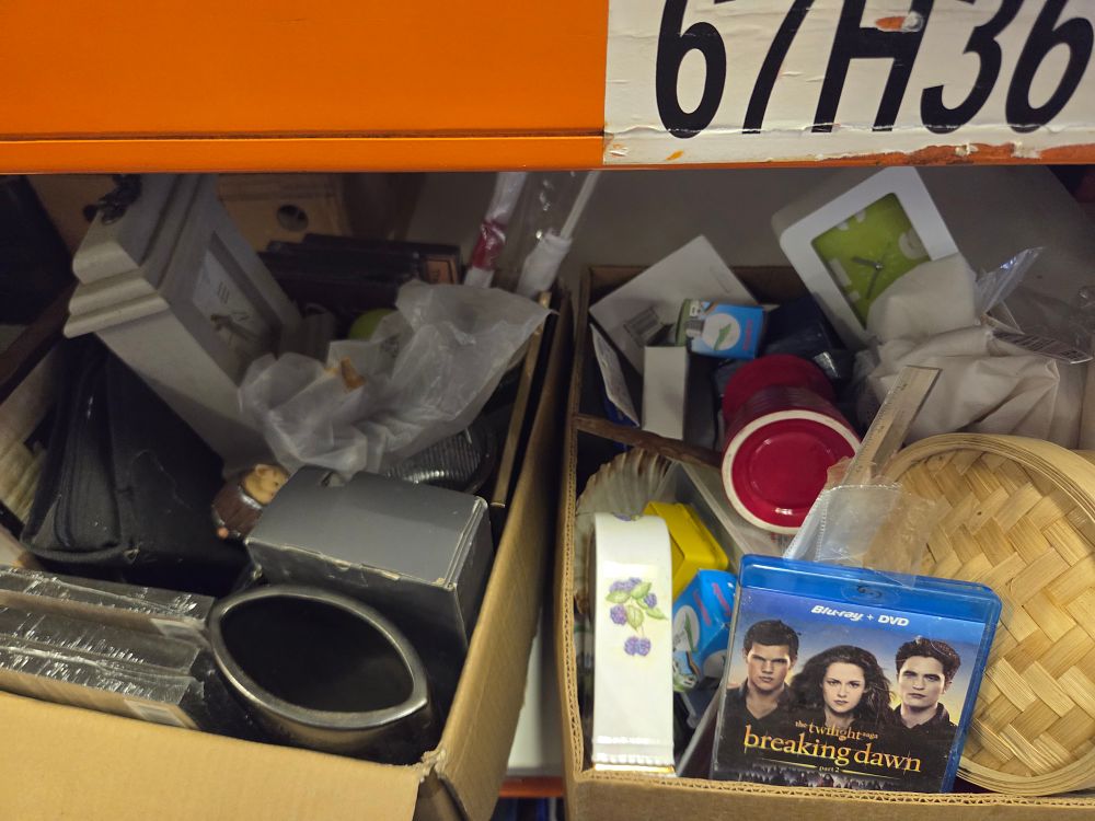 Lot 360 – Two Boxes of Miscellaneous Household Sundries, Media, and Collectables Including Twilight Saga Breaking Dawn Part 2 Blu-ray
