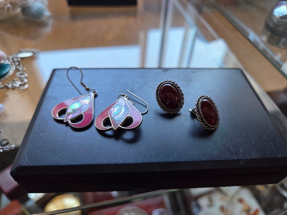 Lot 609 – A Pair of Silver Enamel and Shell Drop Earrings and a Pair of Silver Carnelian Clip-on Earrings 10.19g
