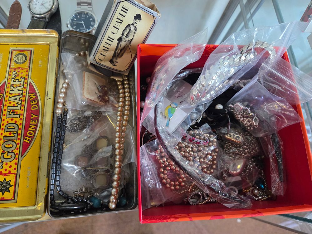 Lot 617 – Two Boxes of Miscellaneous Jewellery, Wristwatches and Advertising Collectables Including W.D. & H.O. Wills Gold Flake Tin