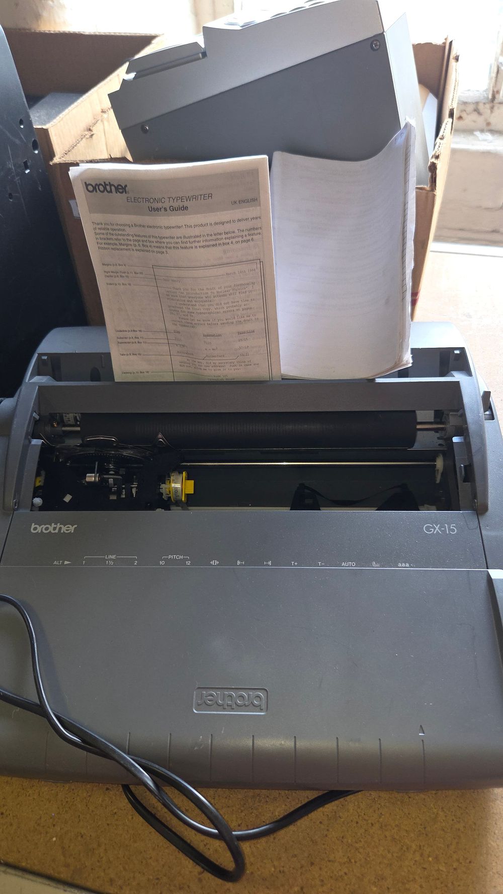 Lot 202 – Brother GX-15 Portable Electronic Typewriter with User Guide powers on