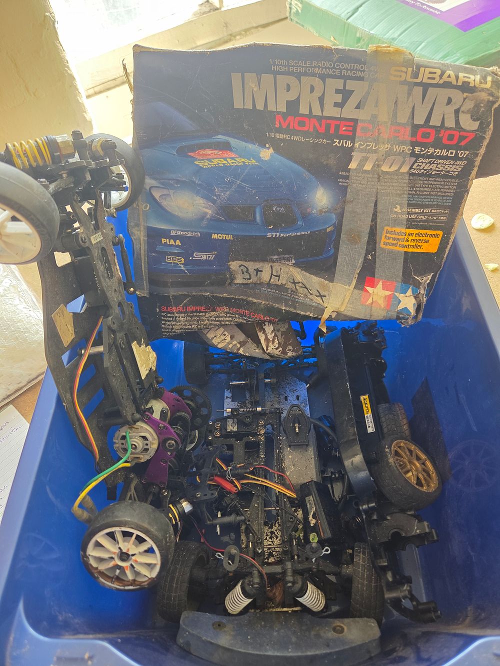 Lot 209 – Box of RC Car Chassis and Parts Including Tamiya Subaru Impreza