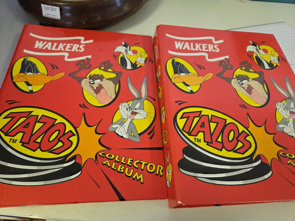 Lot 298 – A Pair of 1996 Walkers Looney Tunes Tazos Collector Albums