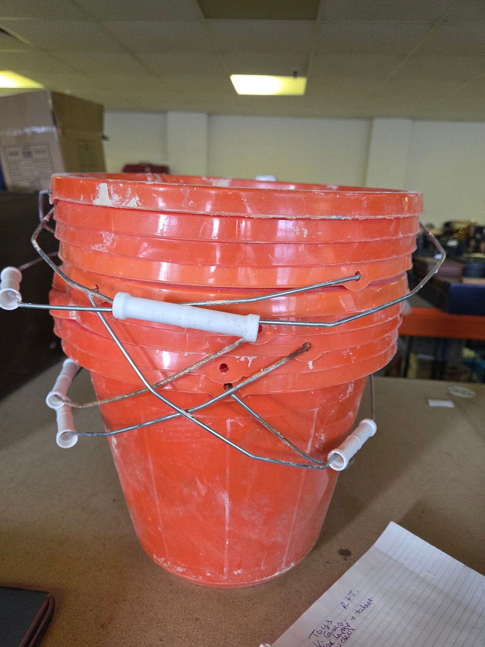 Lot 254 – A Collection of Orange Plastic Five Gallon Buckets