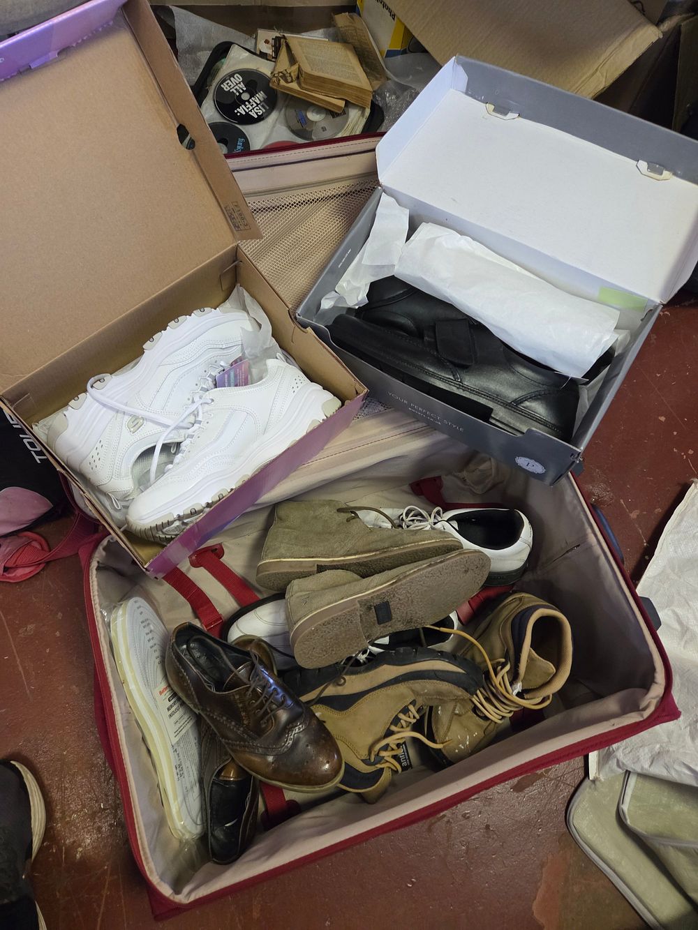 Lot 257 – A Suitcase of Assorted Footwear Including Skechers and Pavers