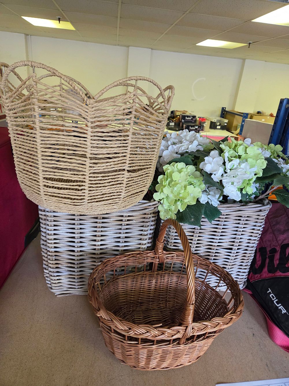 Lot 261 – A Collection of Decorative Woven Wicker Baskets and Faux Hydrangeas