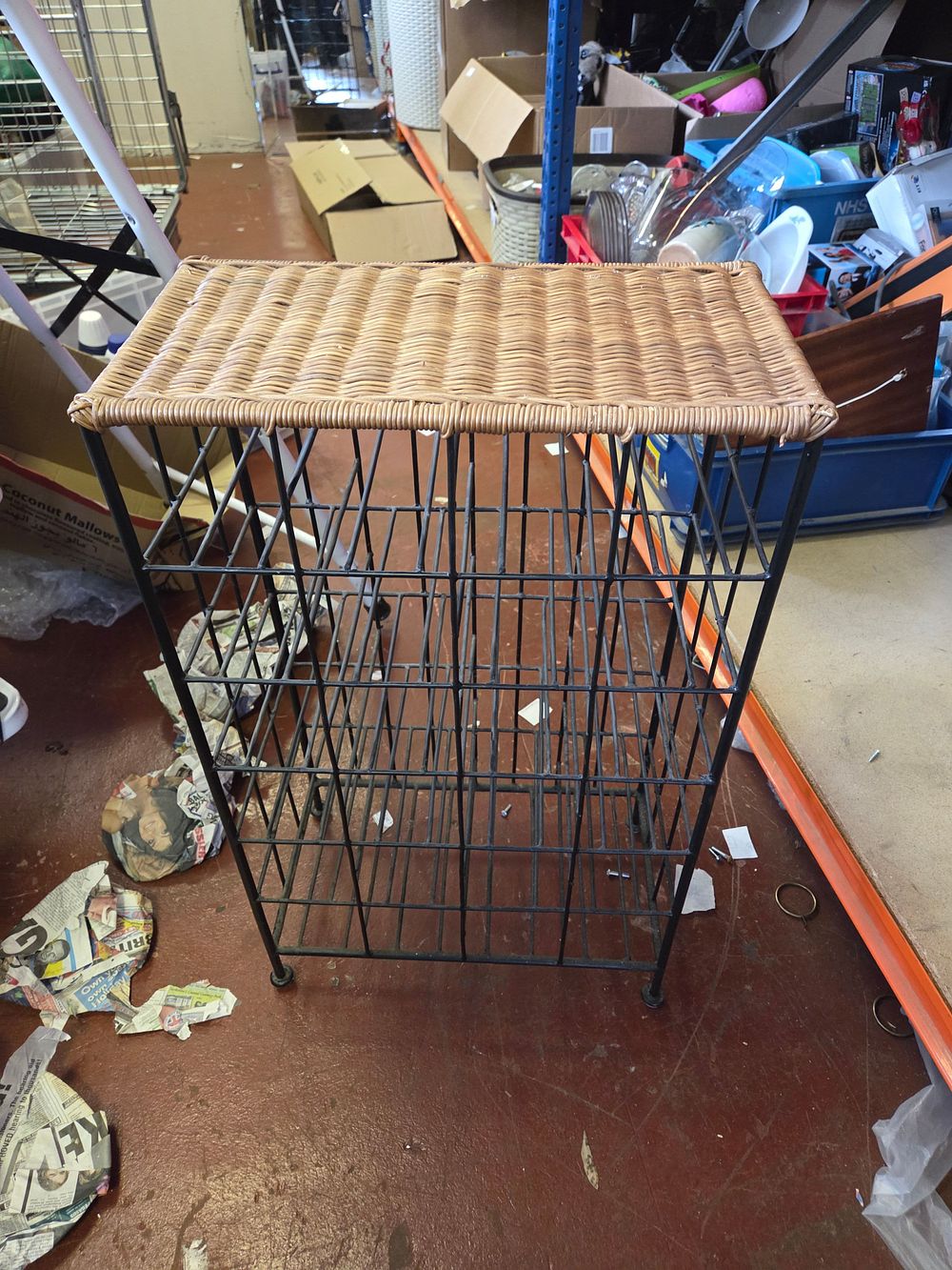 Lot 284 – Woven Rattan and Metal 24-Bottle Floor Standing Wine Rack