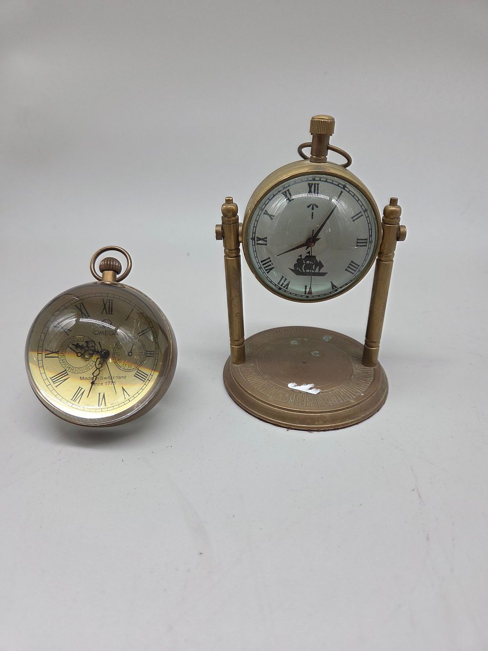 Lot 163 – A Selection of Brass Mechanical Desk Clocks Including Omega