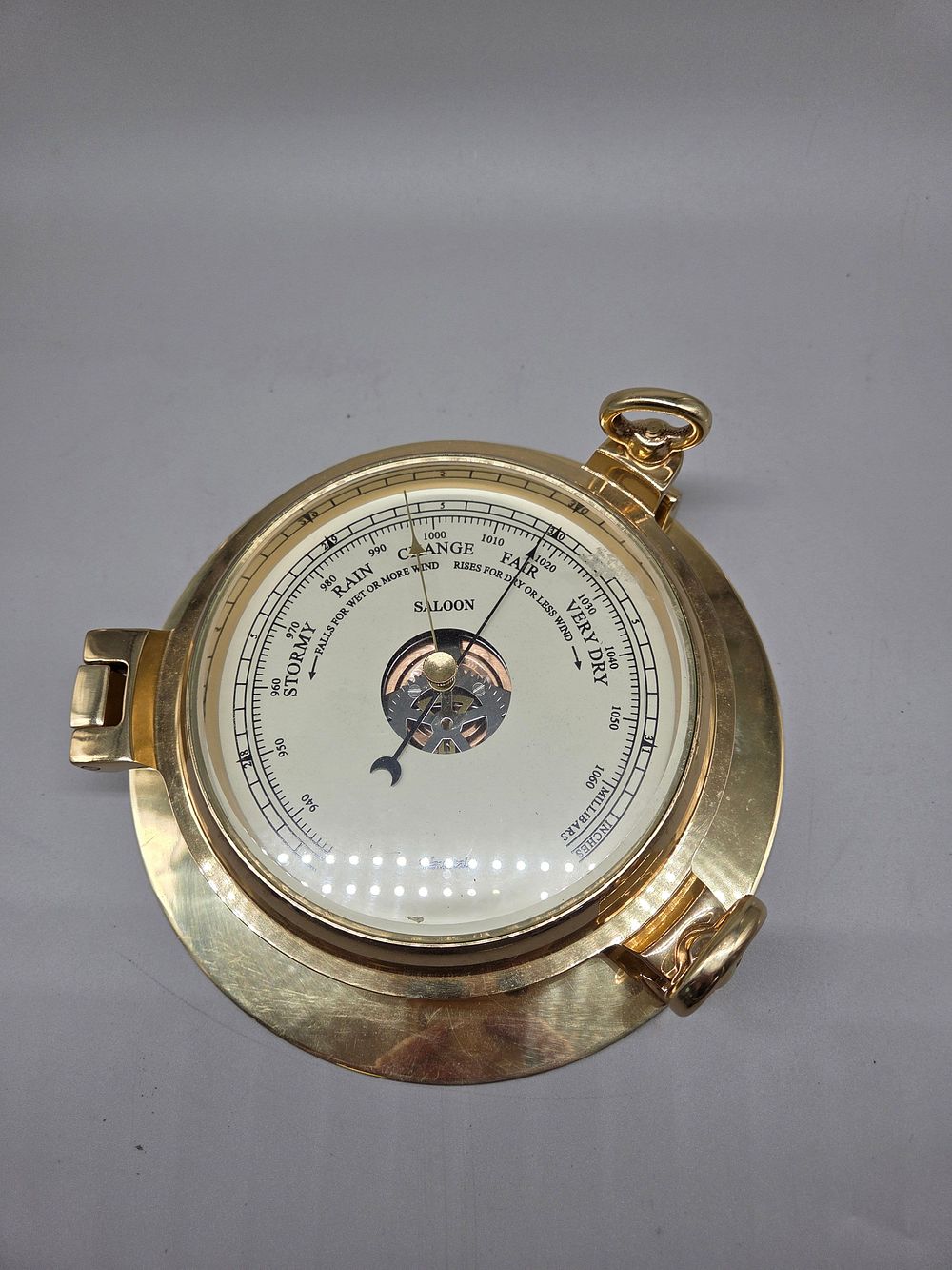 Lot 175 – Nauticalia Brass Porthole Style Saloon Aneroid Barometer