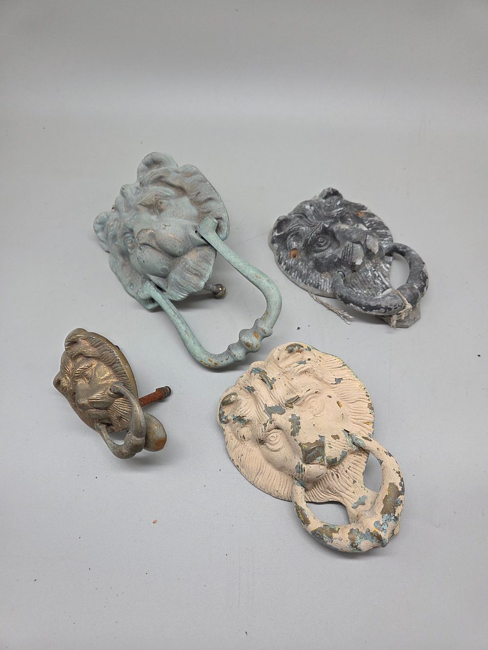 Lot 186 – A Collection of Cast Metal Lion Mask Door Knockers