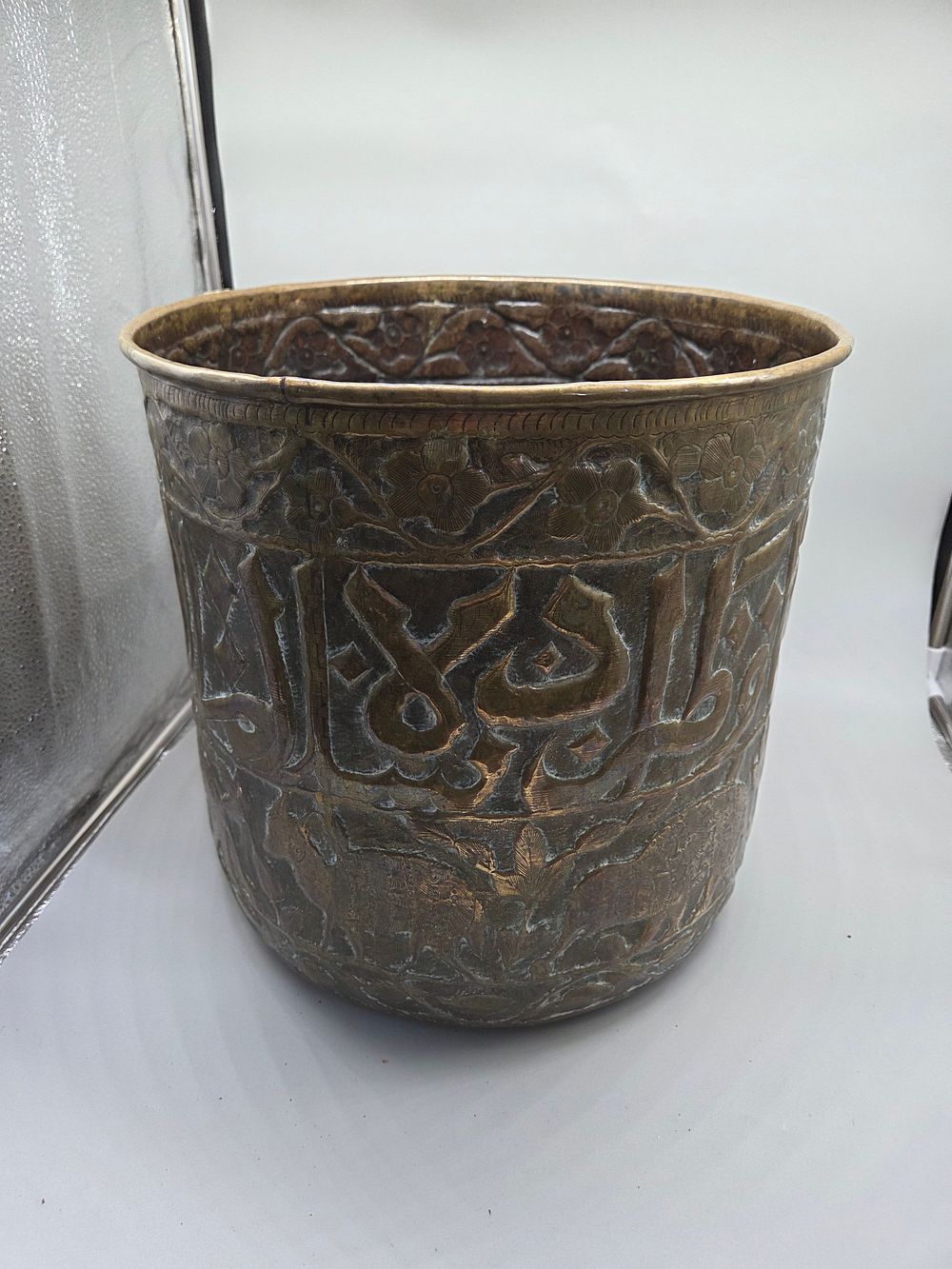 Lot 187 – Lased Chased and Engraved Brass Vessel with Calligraphic and Floral Decoration