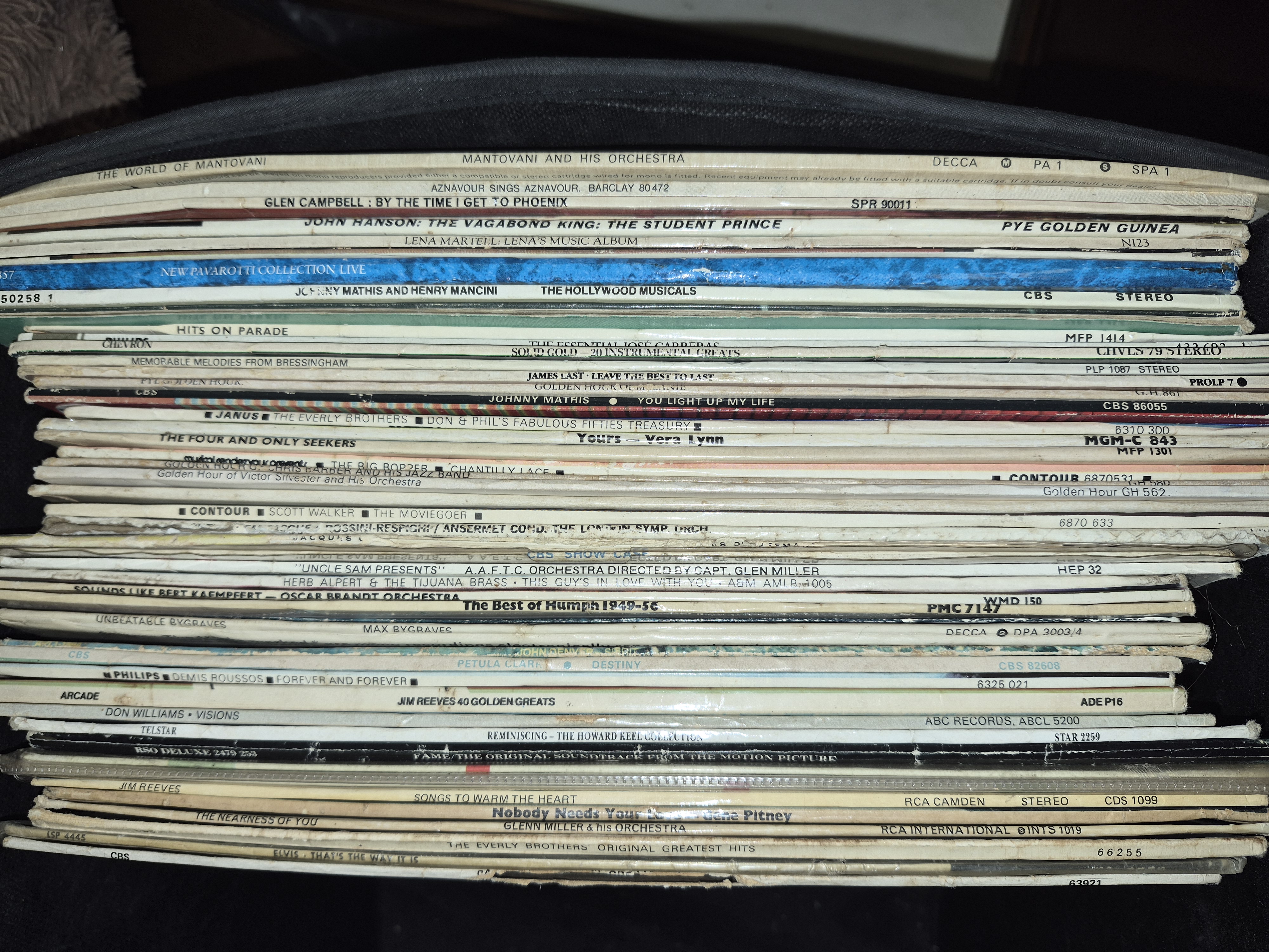 A Collection of Vinyl Records Including Elvis Presley and Glen Campbell