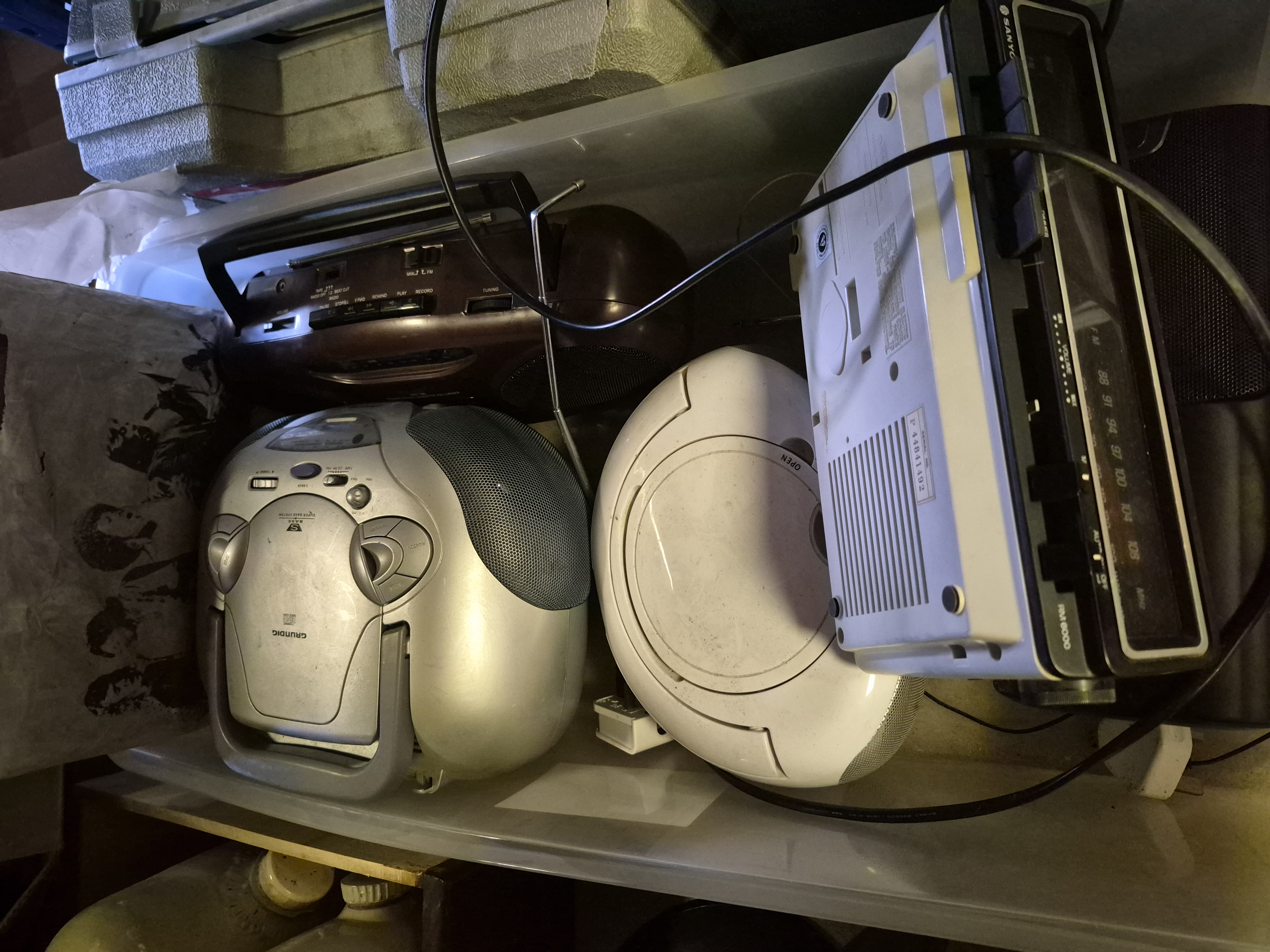 A Box of Portable Audio Equipment Including Grundig and Sanyo
