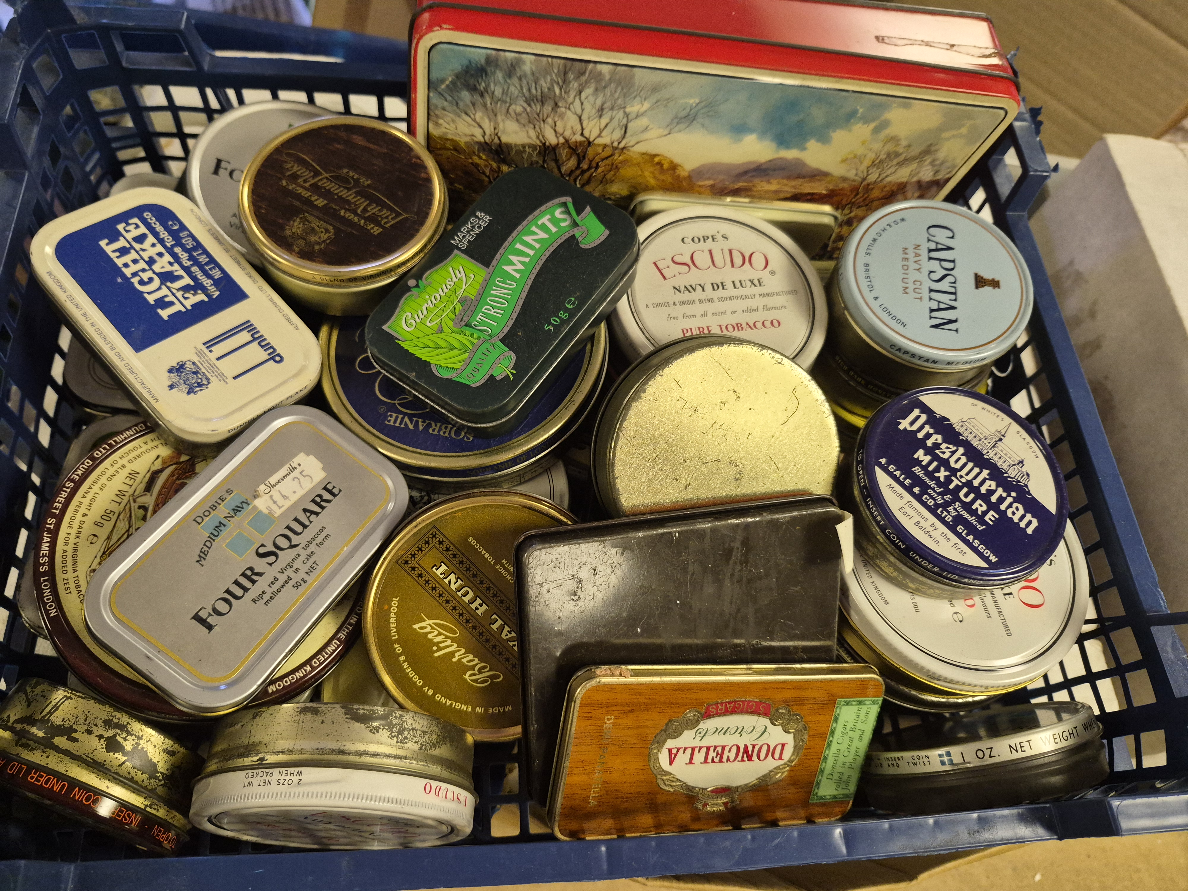 Basket of Vintage Advertising Tins Including Dunhill Capstan and Presbyterian Mixture