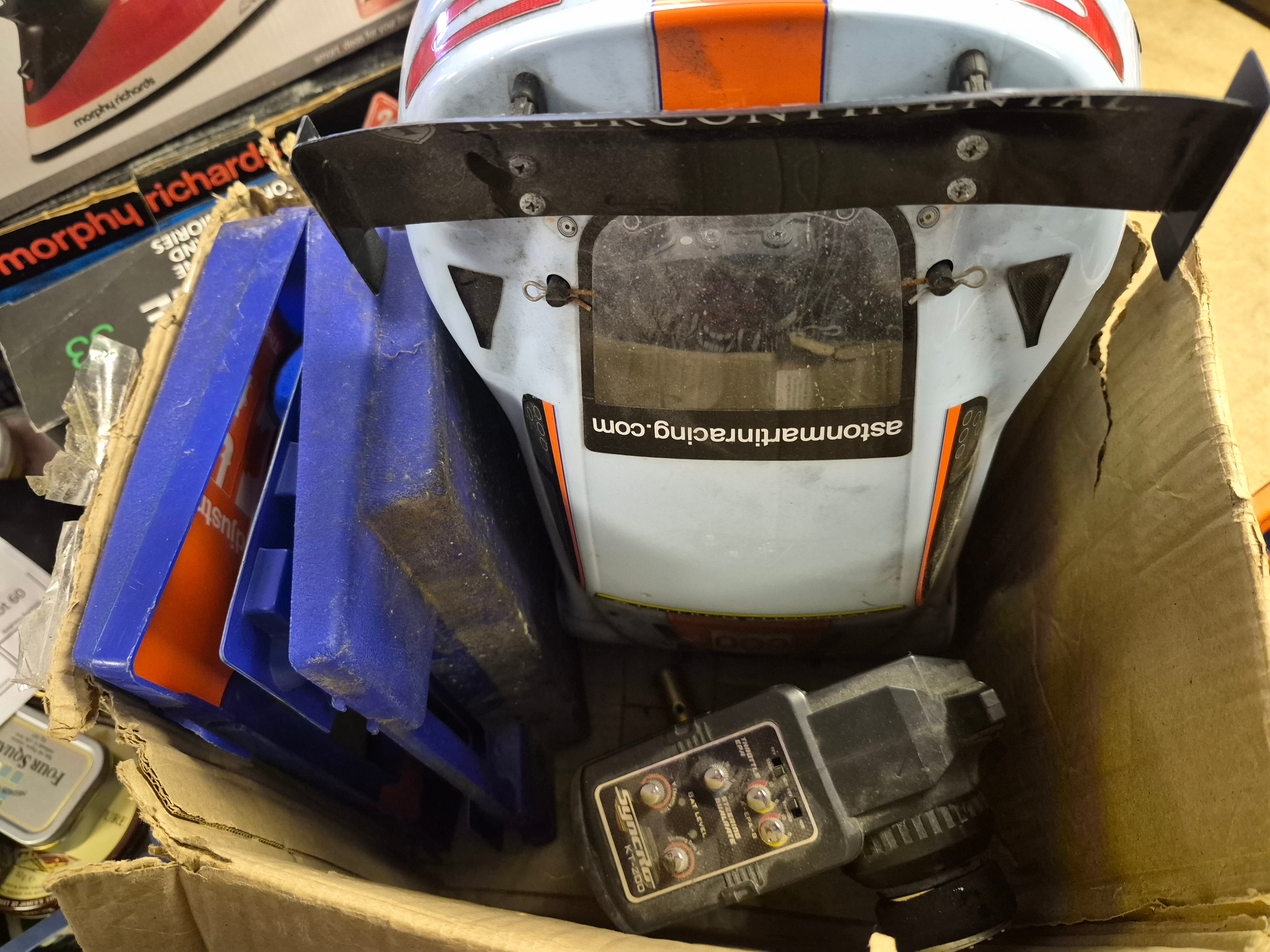 Box of Radio Controlled Model Racing Car and Syncro KT-200 Transmitter