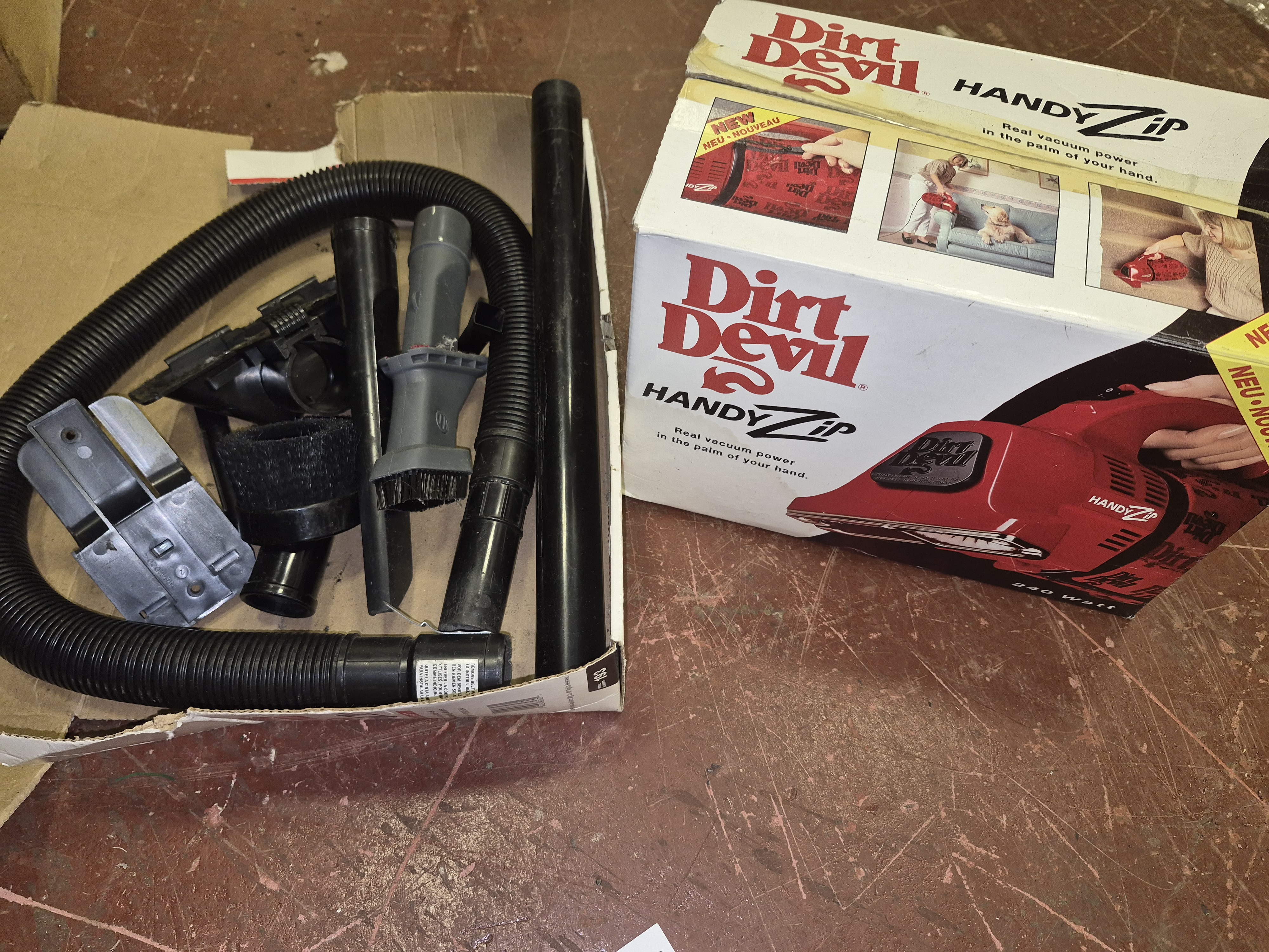 Dirt Devil Handy Zip Handheld Vacuum and Accessories damaged box