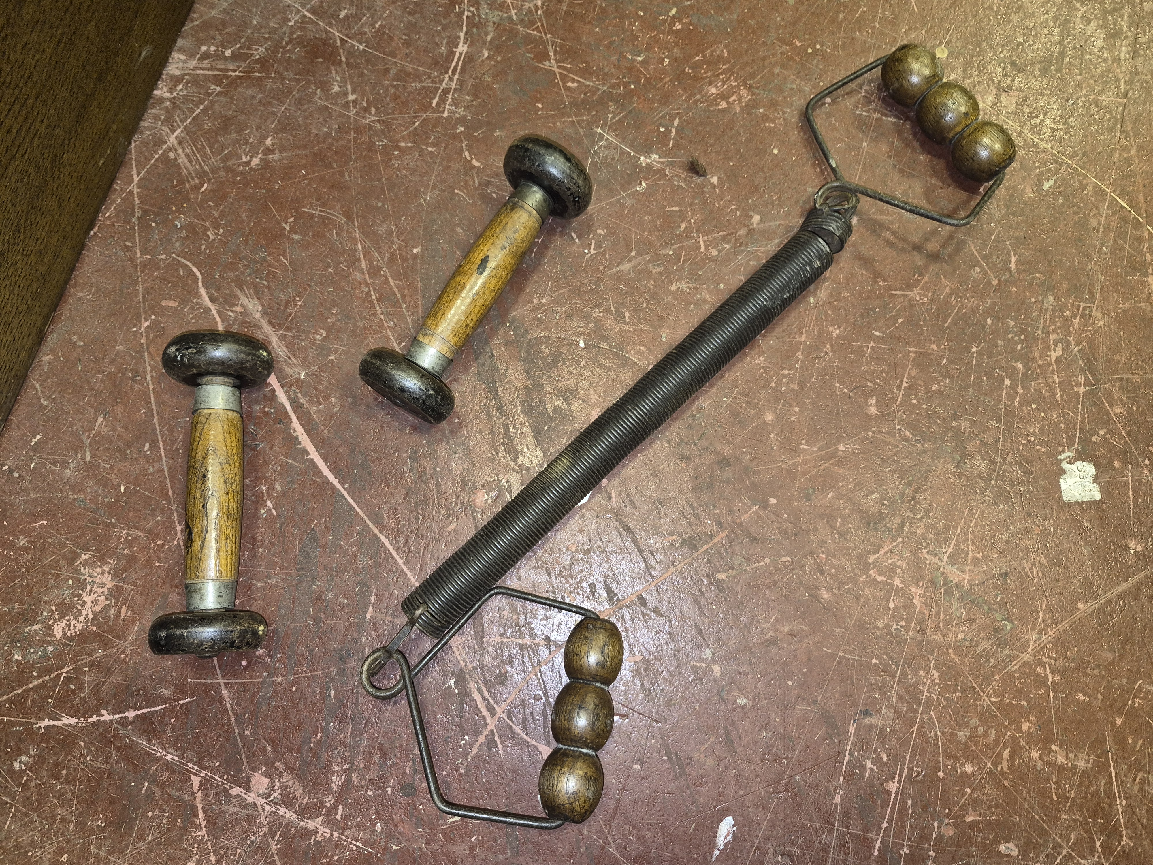 A Selection of Antique Home Fitness Equipment Including Chest Expander and Dumbbells
