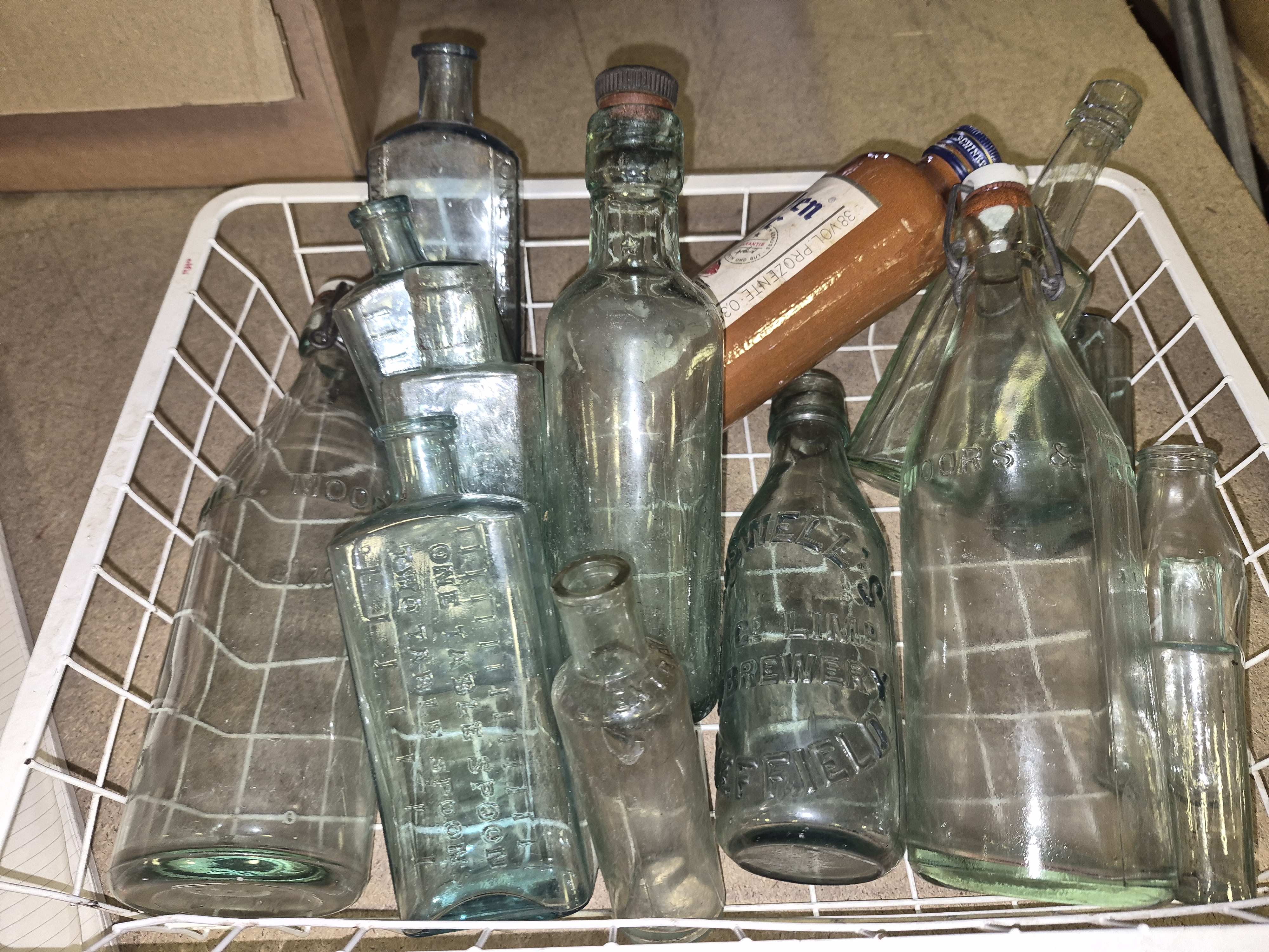 Basket of Vintage Glass Bottles Including Howell's Lime Brewery Sheffield