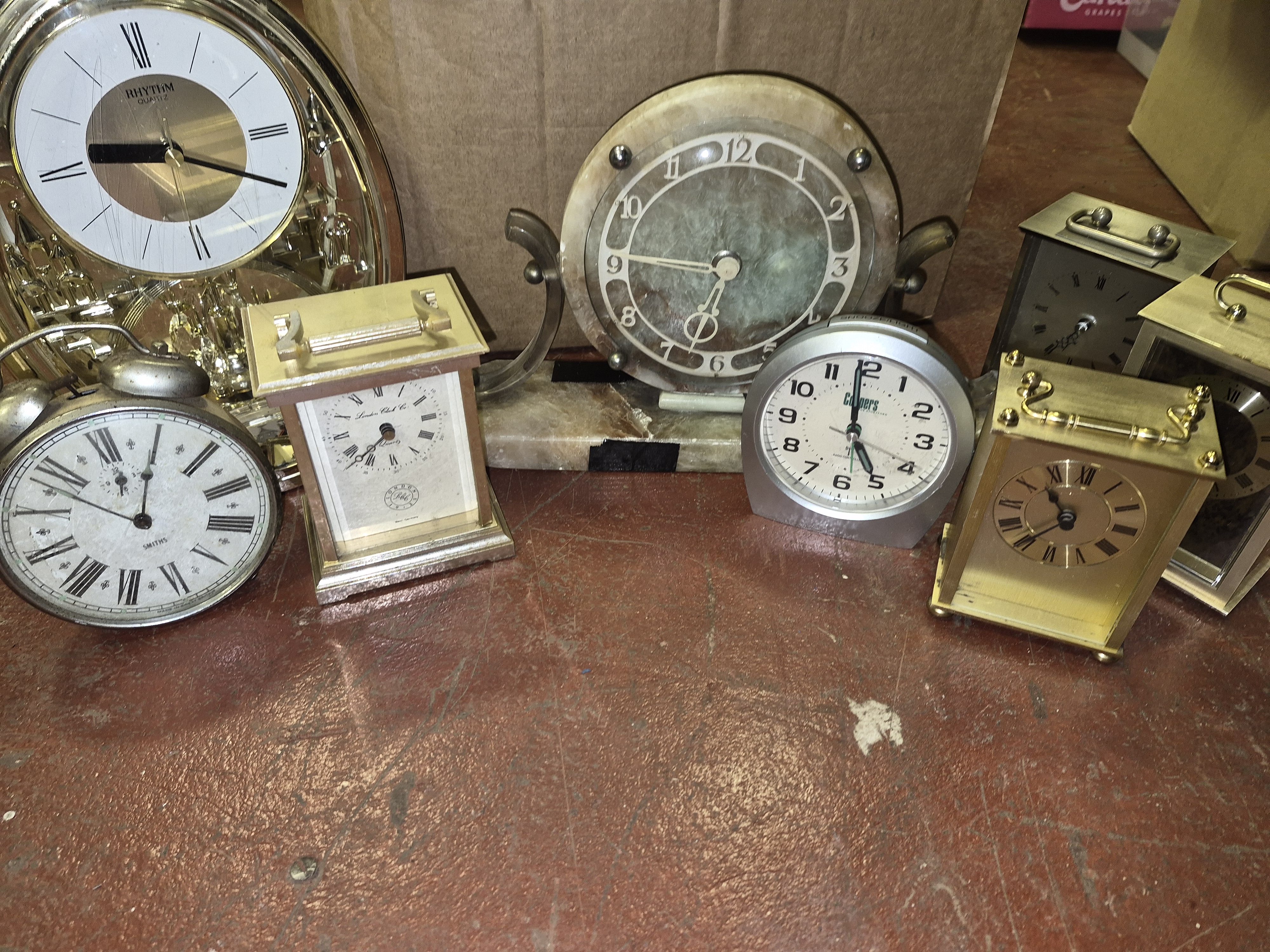 A Collection of Mantel and Carriage Clocks Including Rhythm Smiths and London Clock Co
